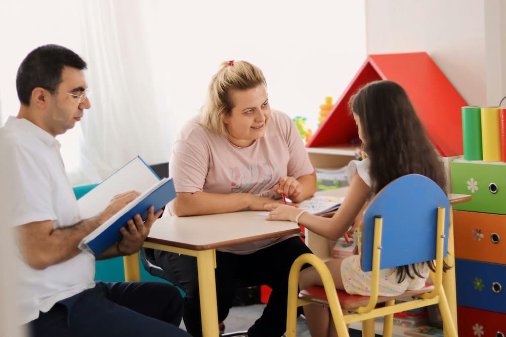 Service coordinator guiding family through early intervention process