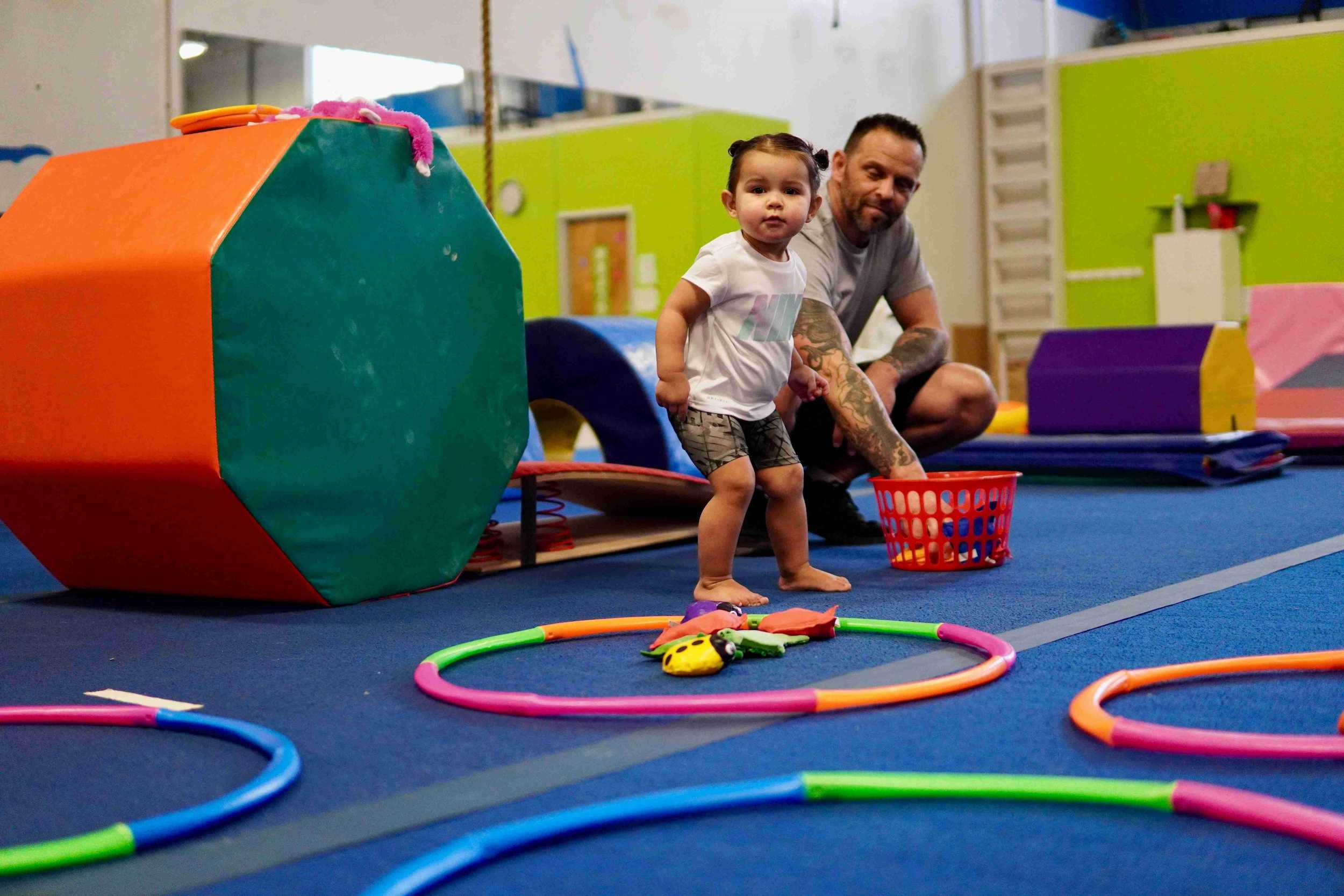 Pediatric physical therapist working with child