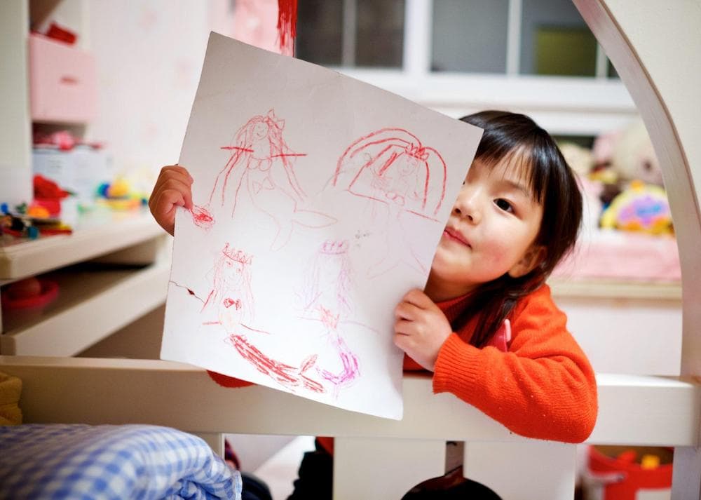 Special instructor working with child on early learning activities