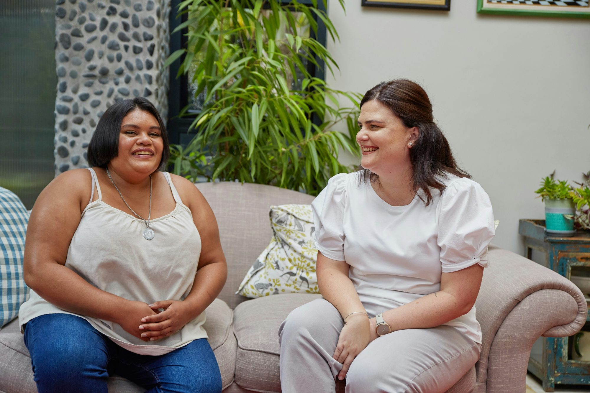 A Knowledge Road coordinator talking with a parent at home