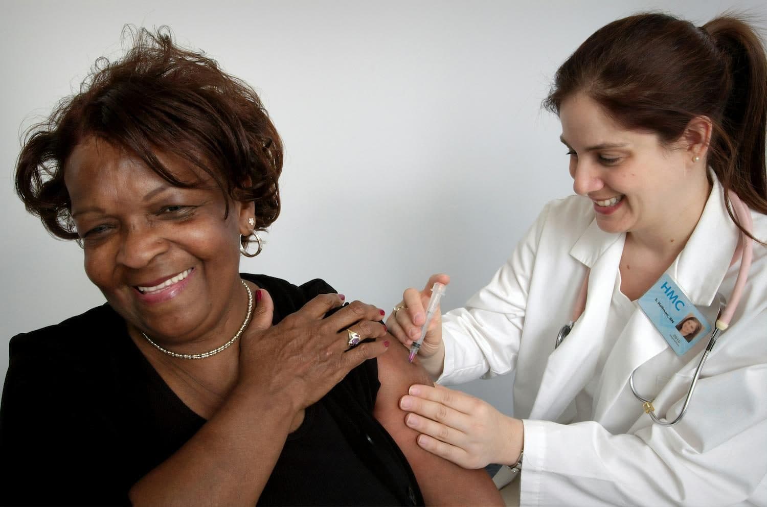 A clinician working warmly with a patient